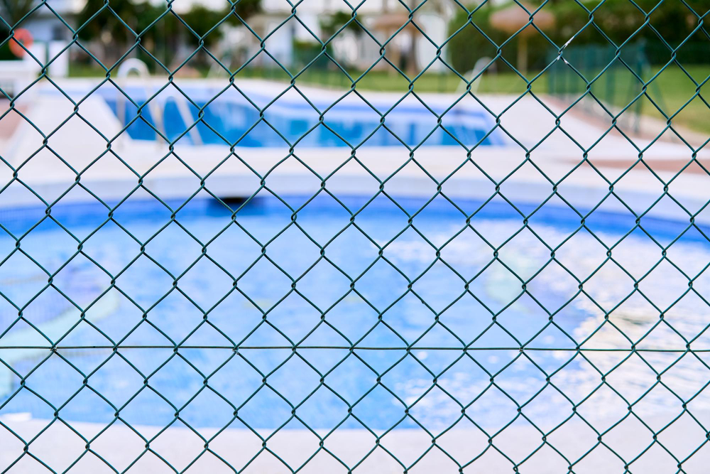 Reasons Your Pool Area Needs a Quality Fence